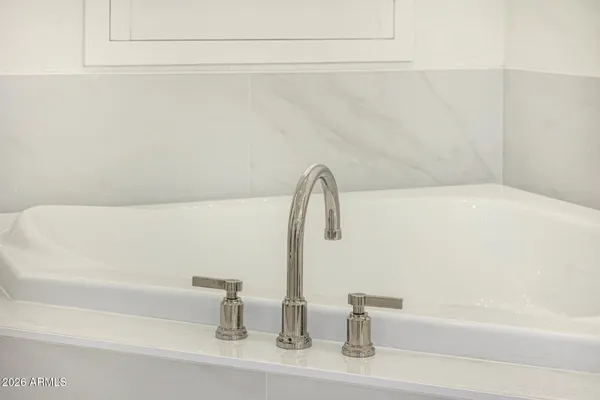 a view of a chairs and table in the back yard