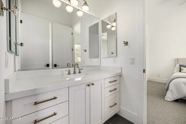 a view of house with a big yard plants and large trees