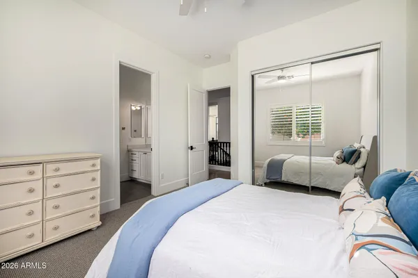 an aerial view of a house with a yard and lake view