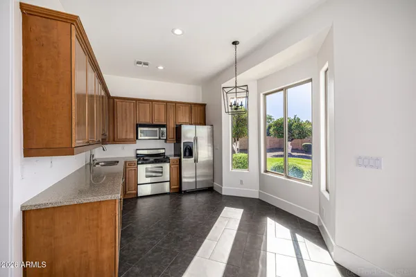 an aerial view of residential houses with outdoor space and river