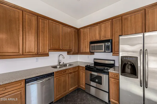 an aerial view of residential houses with outdoor space and river