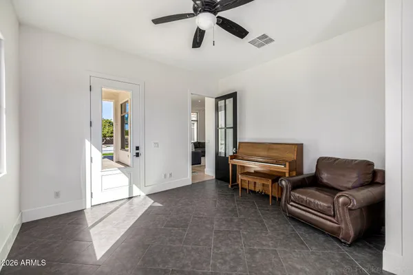 a view of a chairs and table in the patio