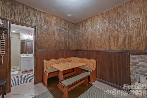 a room with a table and chairs