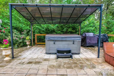 a backyard of a house with yard and outdoor seating