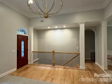 a view of a hallway with a chandelier