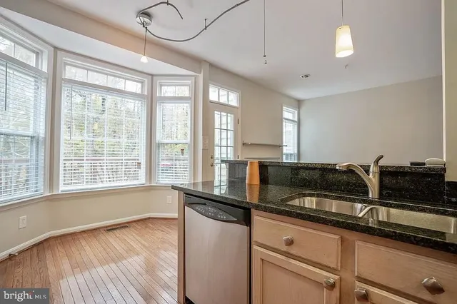 a kitchen with counter top space and a window