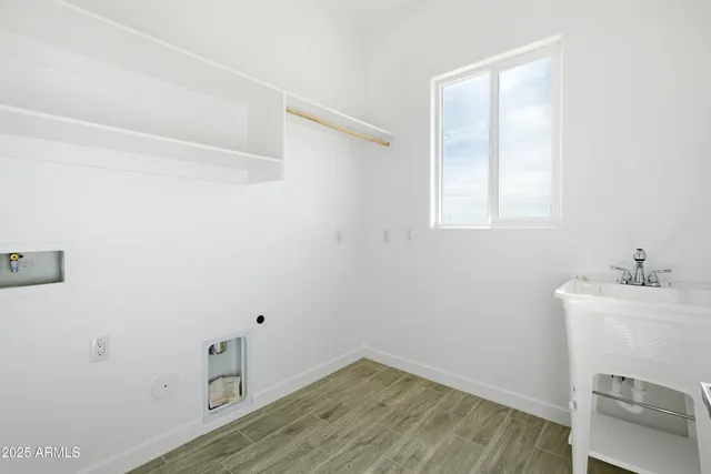 a bathroom with a sink and a window