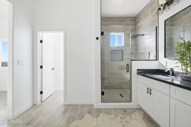 a bathroom with sink and mirror
