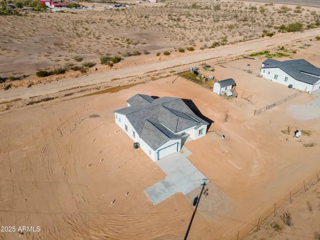 a bathroom with a granite countertop sink a mirror and vanity