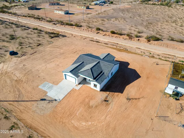 an aerial view of residential houses with ocean