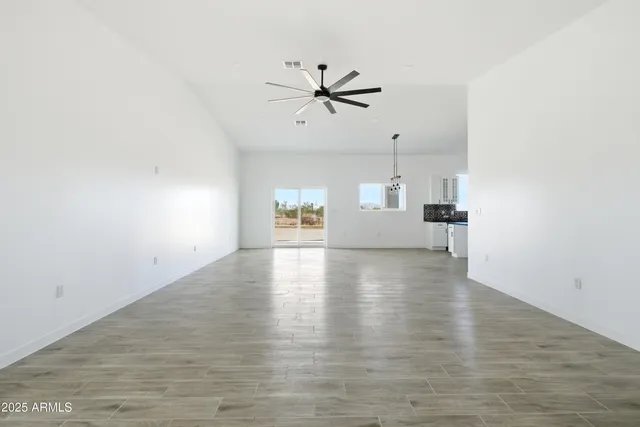 a view of a hallway view with wooden floor