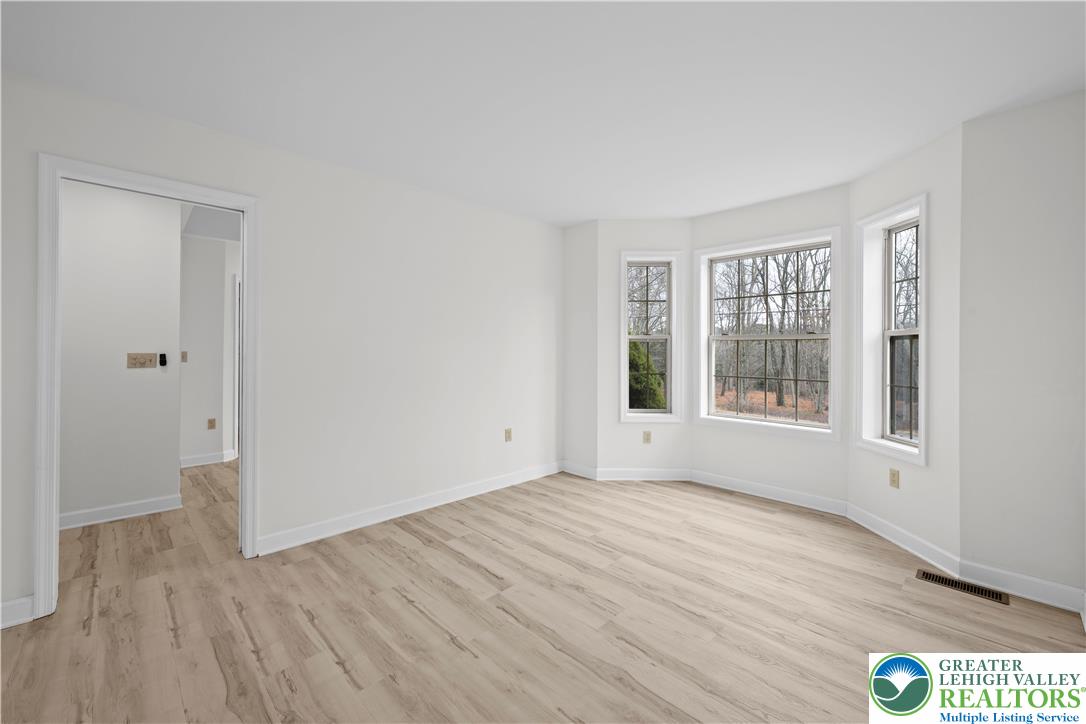 2 Pinewood Circle Hazleton, PA 18202 - Photo 16 of 34 a view of an empty room with wooden floor and a window