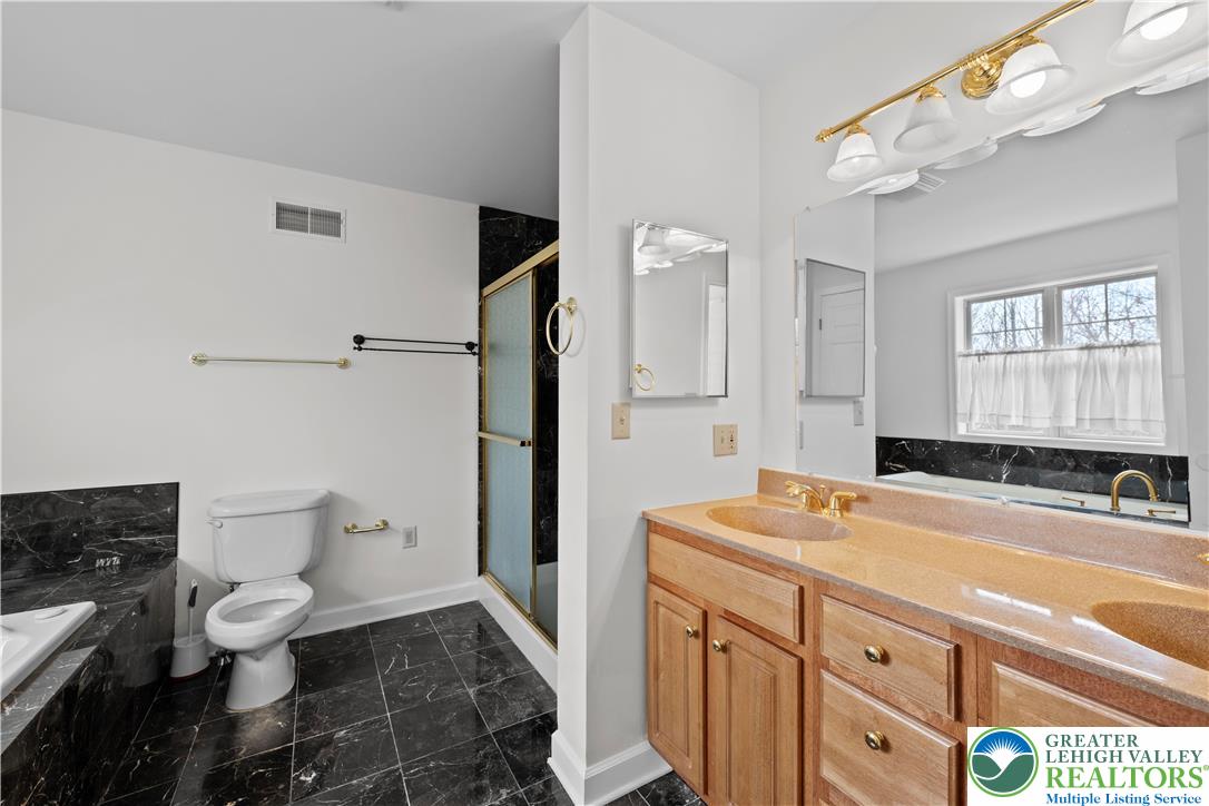 2 Pinewood Circle Hazleton, PA 18202 - Photo 24 of 34 a bathroom with a sink a toilet and a bathtub