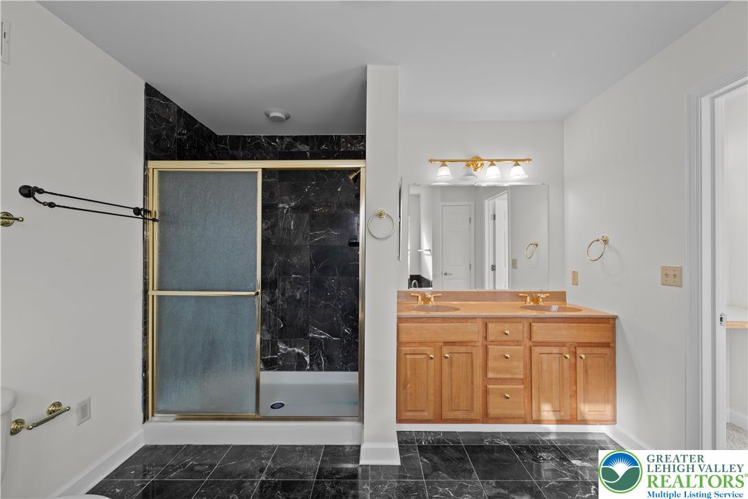 2 Pinewood Circle Hazleton, PA 18202 - Photo 26 of 34 a bathroom with a granite countertop sink a mirror and shower