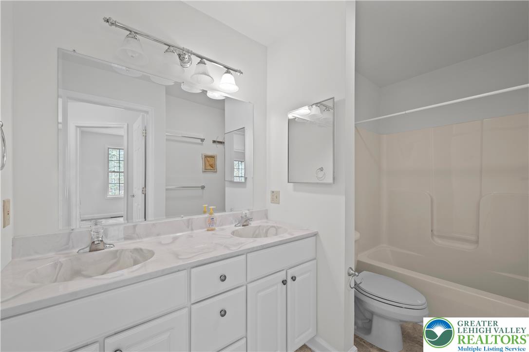 2 Pinewood Circle Hazleton, PA 18202 - Photo 30 of 34 a bathroom with a granite countertop sink a toilet and bathtub