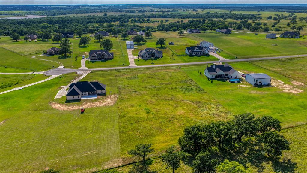 2013 Swallowtail Court Poolville, TX 76487 - Photo 10 of 12 a view of a lake with a city