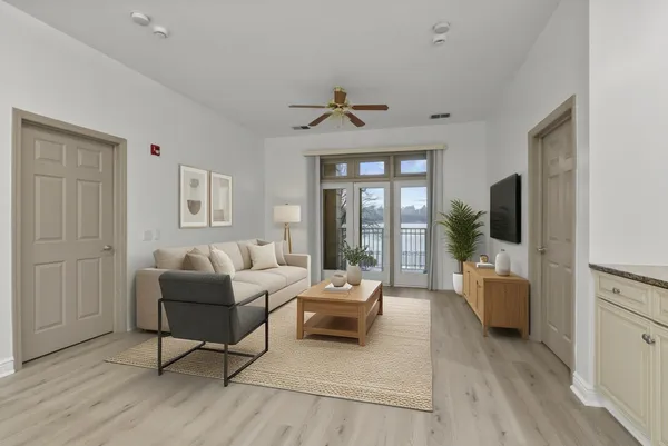 a living room with furniture and a flat screen tv