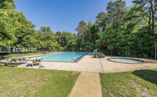 a view of a swimming pool with a yard