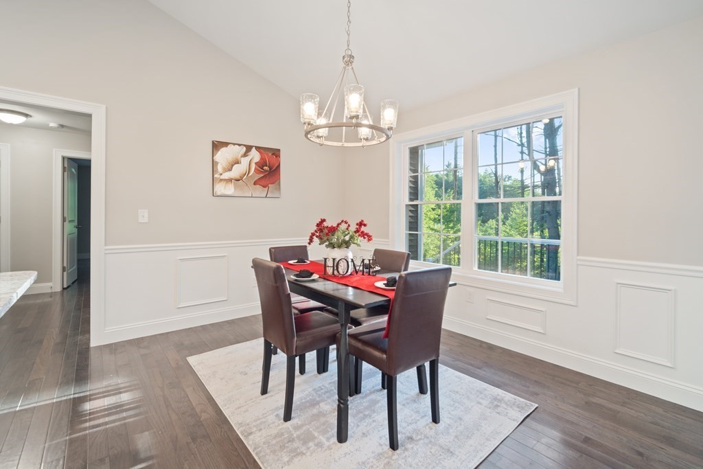 245 Glendale Road Northampton, MA 01062 - Photo 11 of 36 a dining room with furniture a chandelier and wooden floor