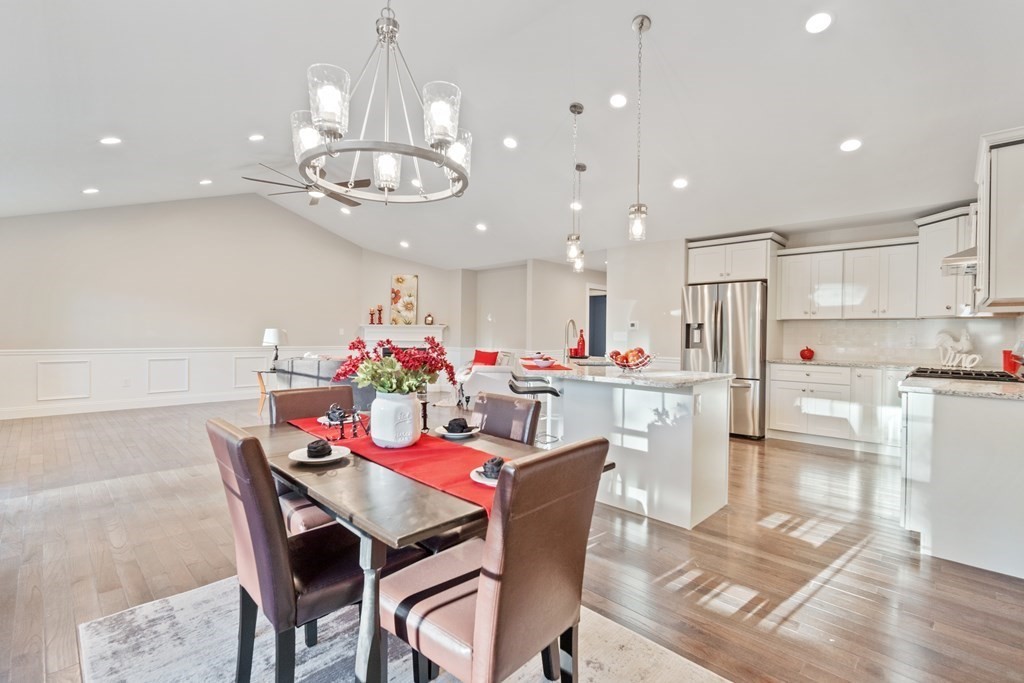 245 Glendale Road Northampton, MA 01062 - Photo 13 of 36 a view of a dining room with furniture and a chandelier