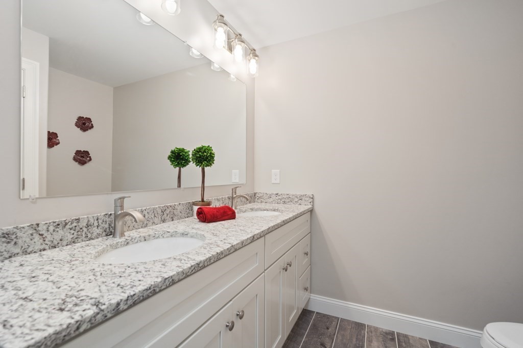 245 Glendale Road Northampton, MA 01062 - Photo 23 of 36 a bathroom with a sink and a mirror
