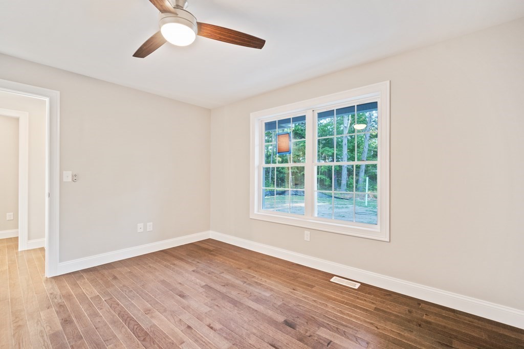 245 Glendale Road Northampton, MA 01062 - Photo 25 of 36 an empty room with wooden floor and windows