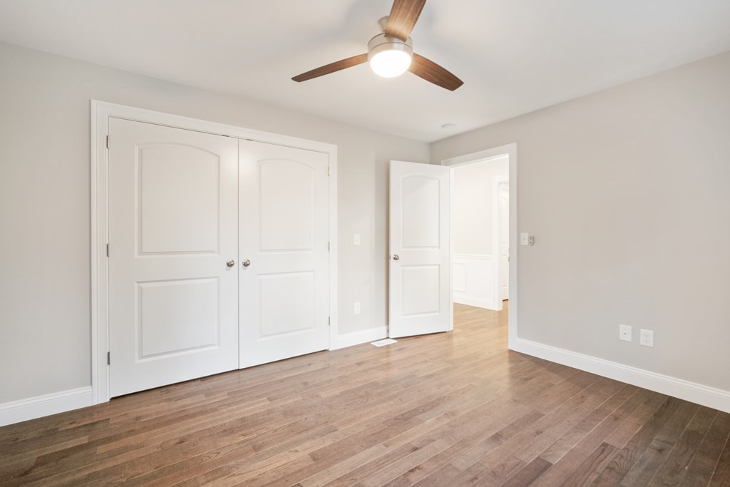 245 Glendale Road Northampton, MA 01062 - Photo 26 of 36 a view of an empty room with wooden floor