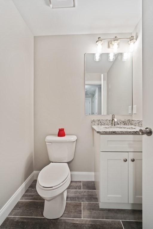 245 Glendale Road Northampton, MA 01062 - Photo 28 of 36 a bathroom with a toilet sink and mirror