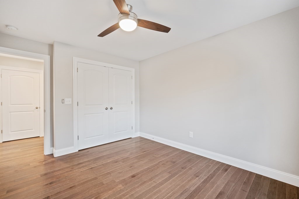 245 Glendale Road Northampton, MA 01062 - Photo 30 of 36 a view of an empty room with wooden floor