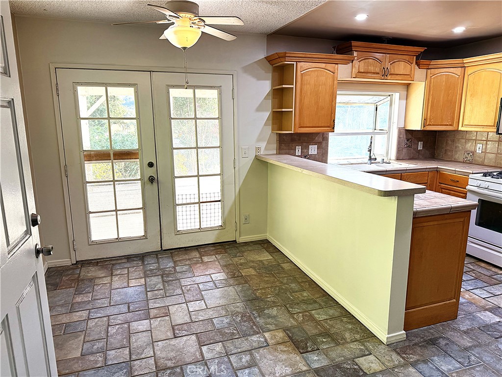 6652 Valmont Street Tujunga, CA 91042 - Photo 2 of 16 a view of a kitchen with a sink and a microwave