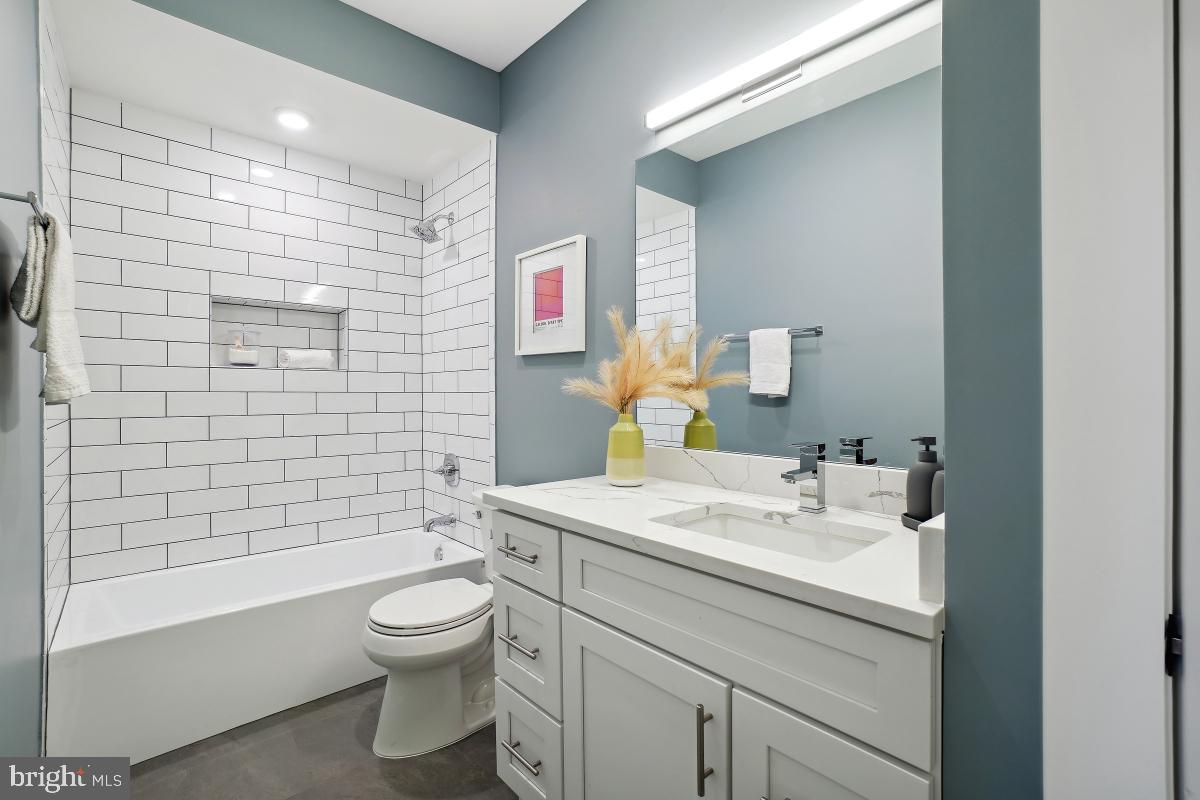 1605 Holbrook Street Northeast, Unit 1 Washington, DC 20002 - Photo 14 of 25 a bathroom with a sink a toilet and shower
