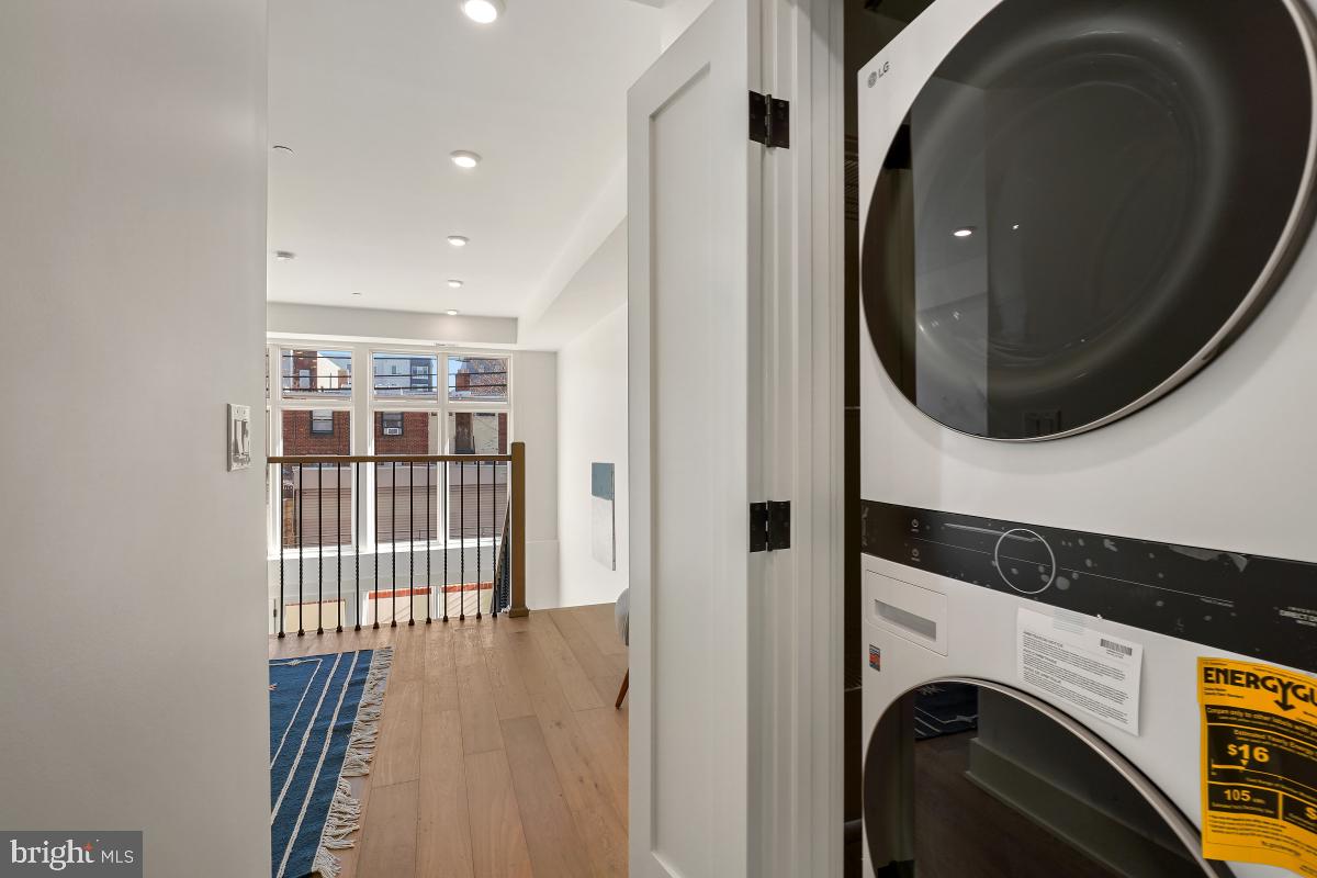 1605 Holbrook Street Northeast, Unit 1 Washington, DC 20002 - Photo 15 of 25 a view of a hallway with washer and dryer