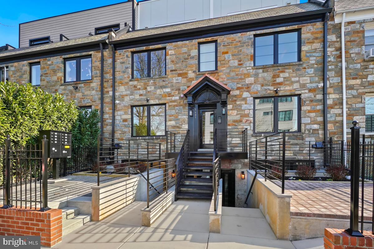 1605 Holbrook Street Northeast, Unit 1 Washington, DC 20002 - Photo 2 of 25 a front view of a house with glass windows