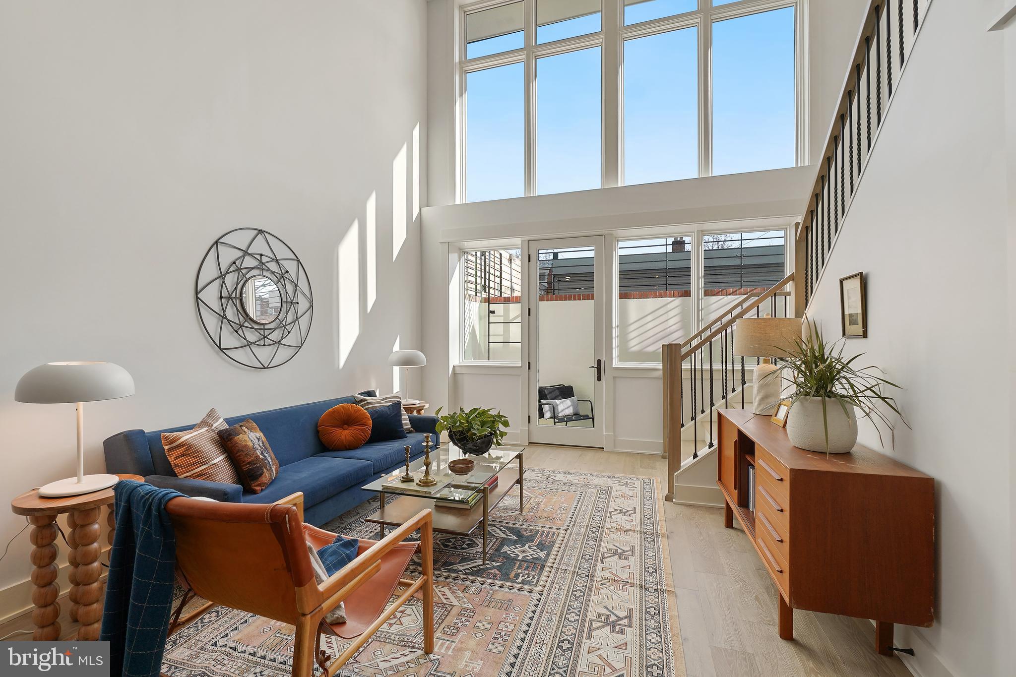 1605 Holbrook Street Northeast, Unit 1 Washington, DC 20002 - Photo 4 of 25 a living room with furniture a rug and a window