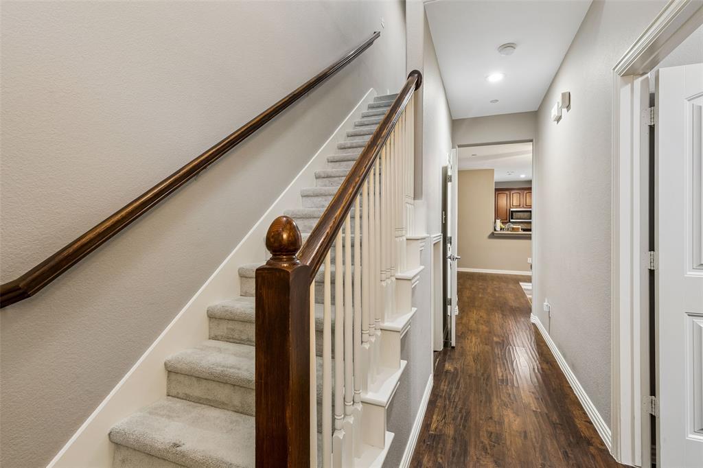 5500 Conch Train Road McKinney, TX 75070 - Photo 13 of 34 a view of a hallway with wooden floor and staircase