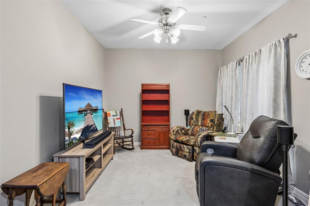 5500 Conch Train Road McKinney, TX 75070 - Photo 15 of 34 a living room with furniture a couch and a flat screen tv