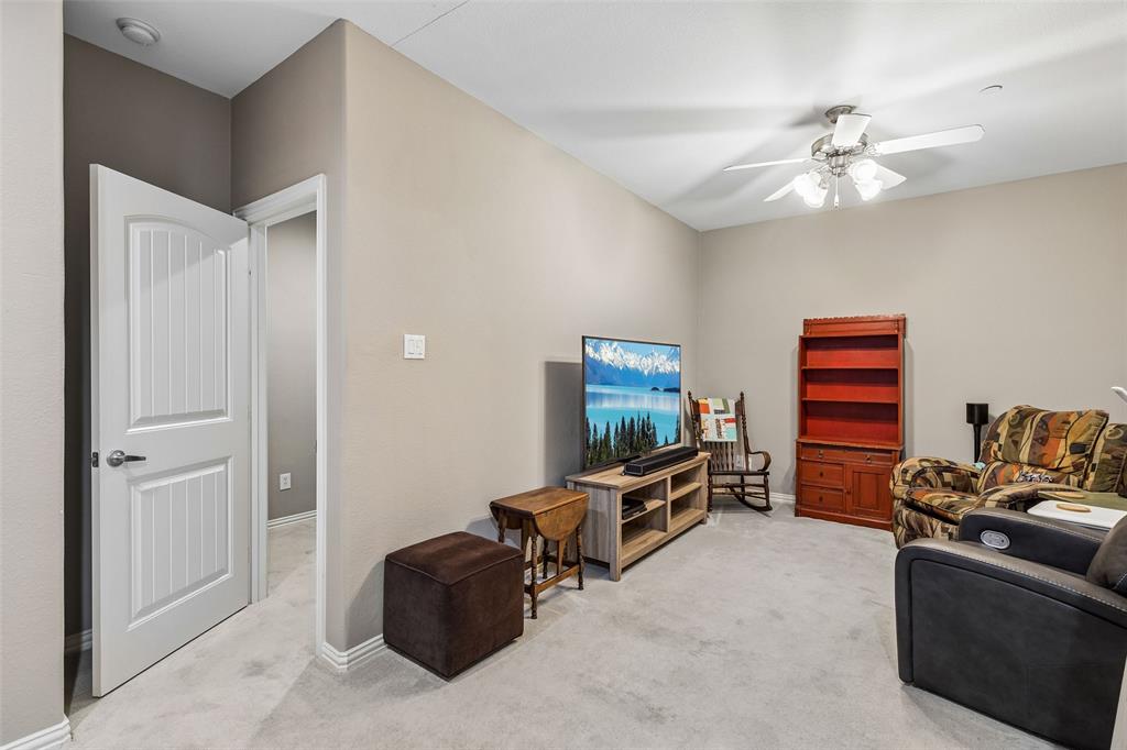 5500 Conch Train Road McKinney, TX 75070 - Photo 16 of 34 a living room with furniture and a flat screen tv