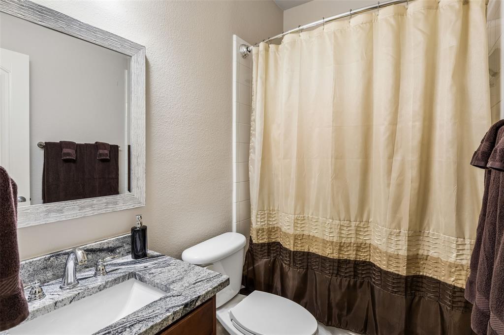 5500 Conch Train Road McKinney, TX 75070 - Photo 19 of 34 a bathroom with a granite countertop sink and a mirror