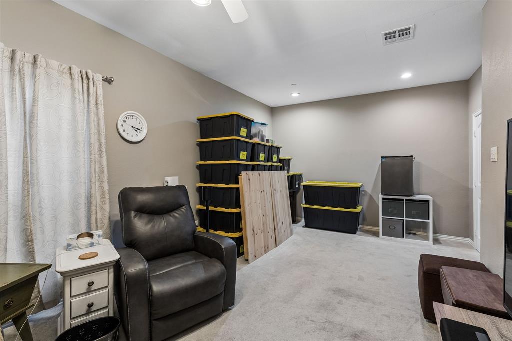 5500 Conch Train Road McKinney, TX 75070 - Photo 20 of 34 a living room with furniture and a flat screen tv