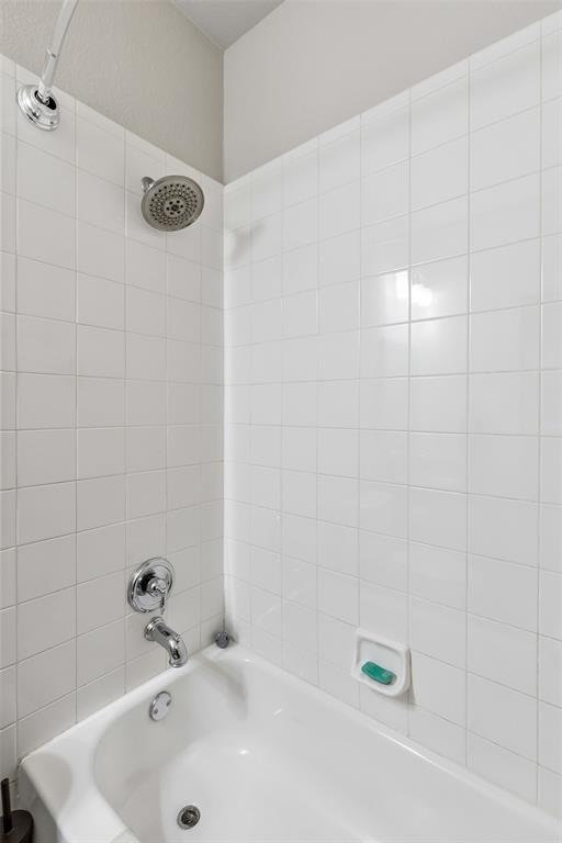 5500 Conch Train Road McKinney, TX 75070 - Photo 21 of 34 a bathroom with a white bath tub and a sink