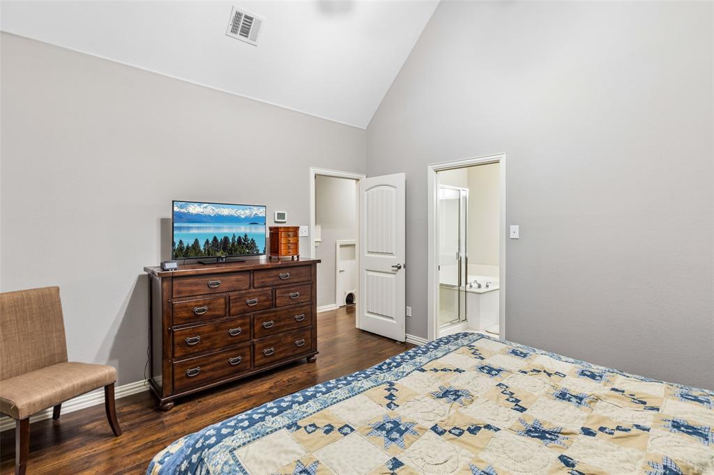 5500 Conch Train Road McKinney, TX 75070 - Photo 23 of 34 a bedroom with a bed and furniture