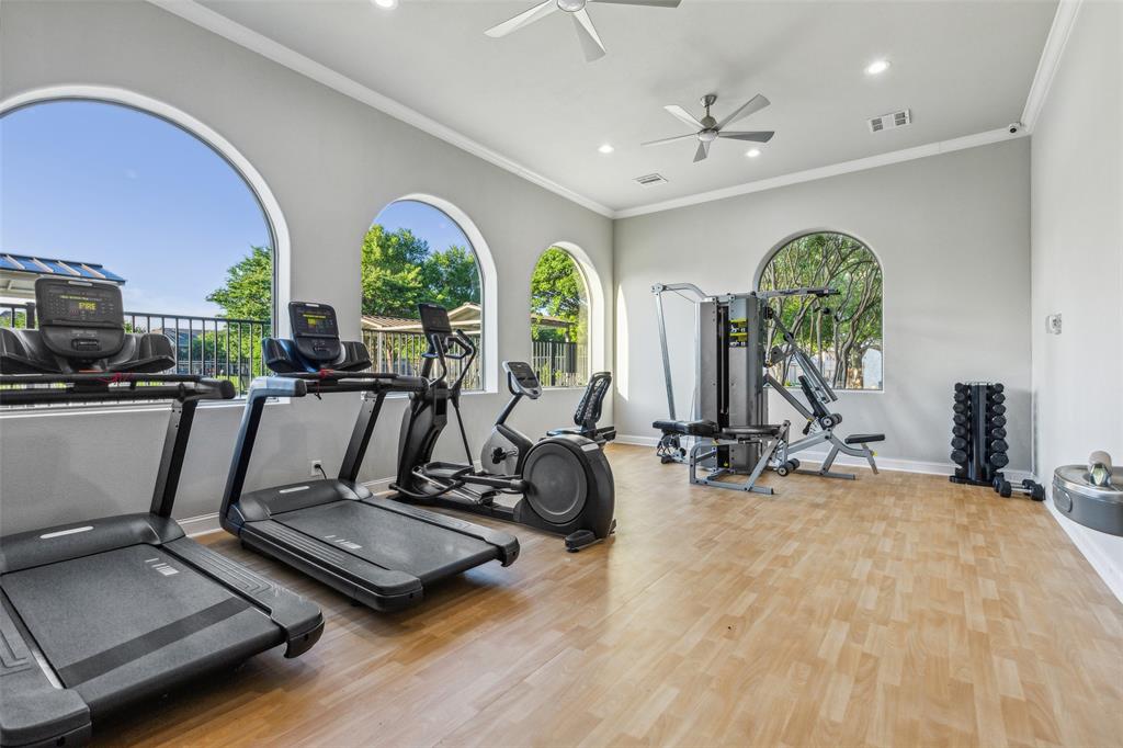5500 Conch Train Road McKinney, TX 75070 - Photo 33 of 34 a room with gym equipment and large mirror