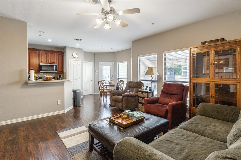 5500 Conch Train Road McKinney, TX 75070 - Photo 4 of 34 a living room with furniture wooden floor and a large window