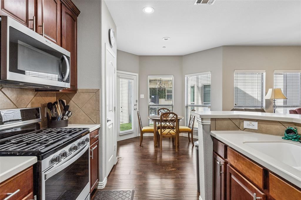 5500 Conch Train Road McKinney, TX 75070 - Photo 5 of 34 a kitchen with a stove and a sink