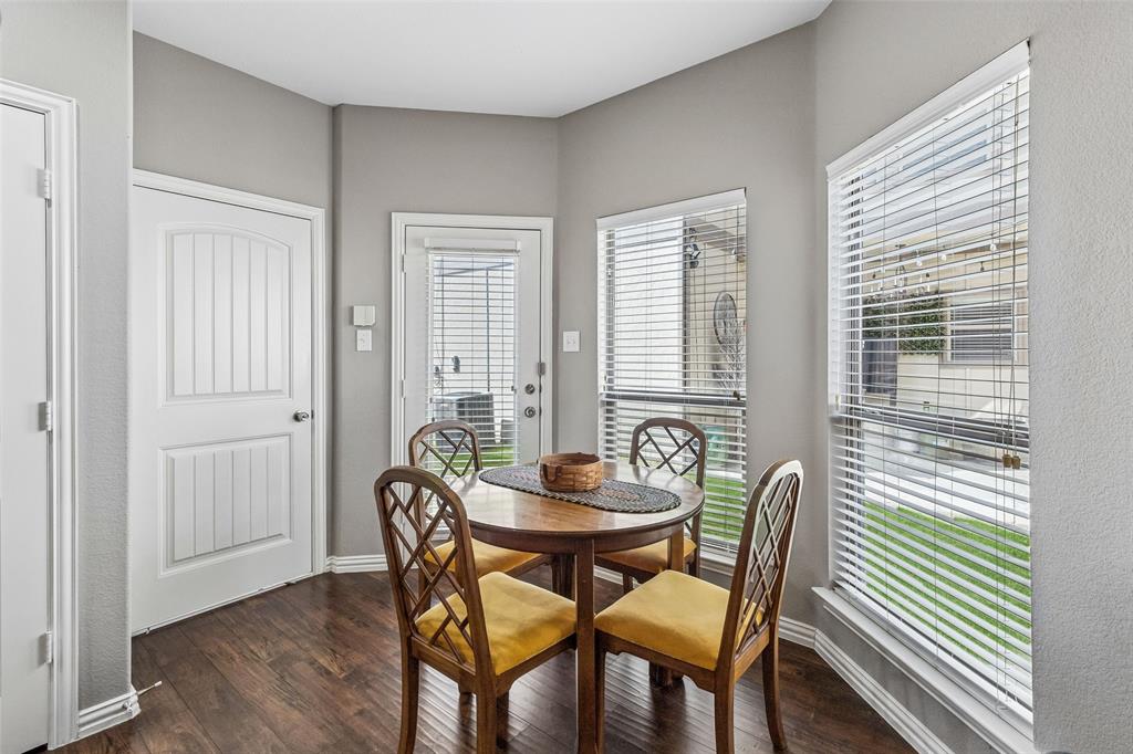 5500 Conch Train Road McKinney, TX 75070 - Photo 8 of 34 a dining room with furniture and wooden floor