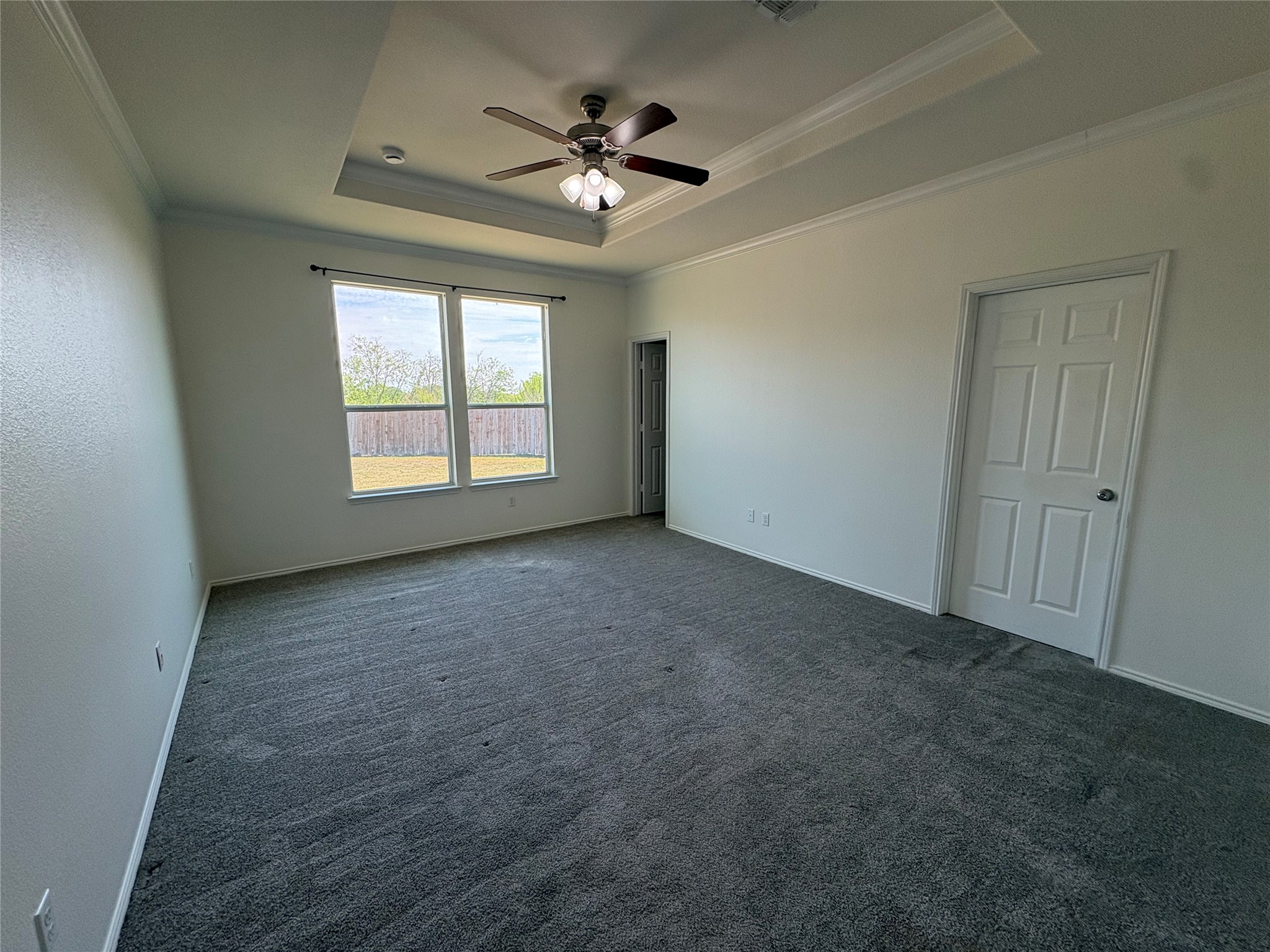 11617 Murron Drive Austin, TX 78754 - Photo 14 of 30 an empty room with windows and ceiling fan