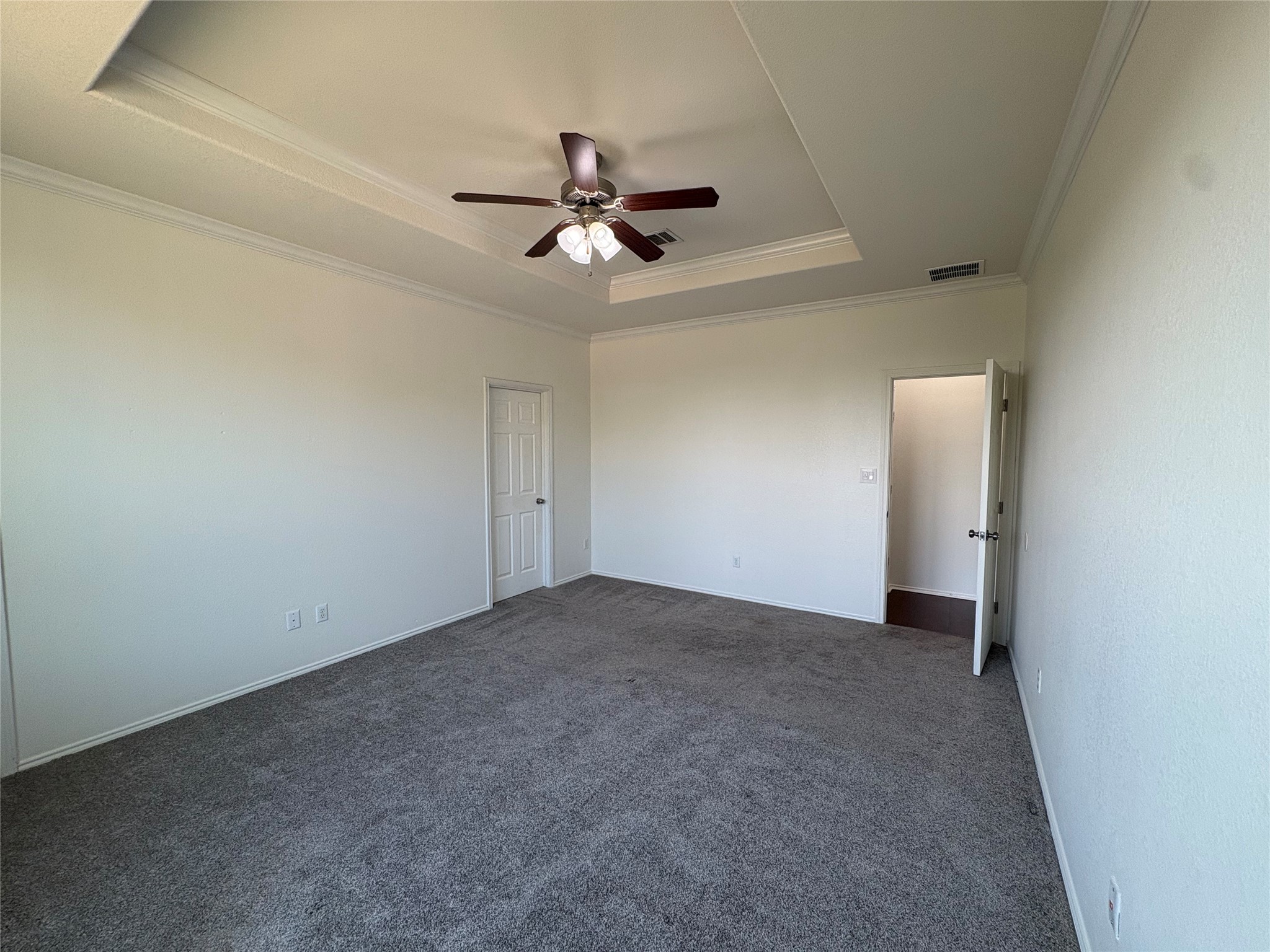 11617 Murron Drive Austin, TX 78754 - Photo 15 of 30 an empty room with a ceiling fan and carpet