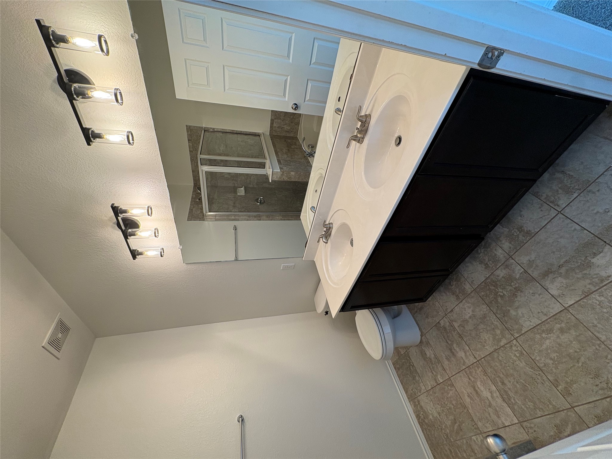 11617 Murron Drive Austin, TX 78754 - Photo 16 of 30 a bathroom with a double vanity sink mirror and toilet