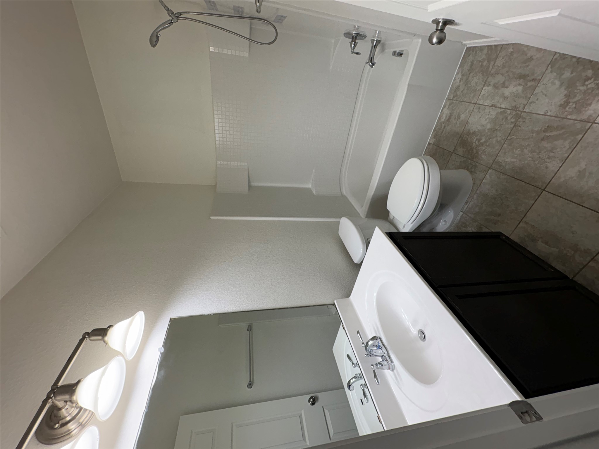 11617 Murron Drive Austin, TX 78754 - Photo 22 of 30 a bathroom with a sink a toilet and shower