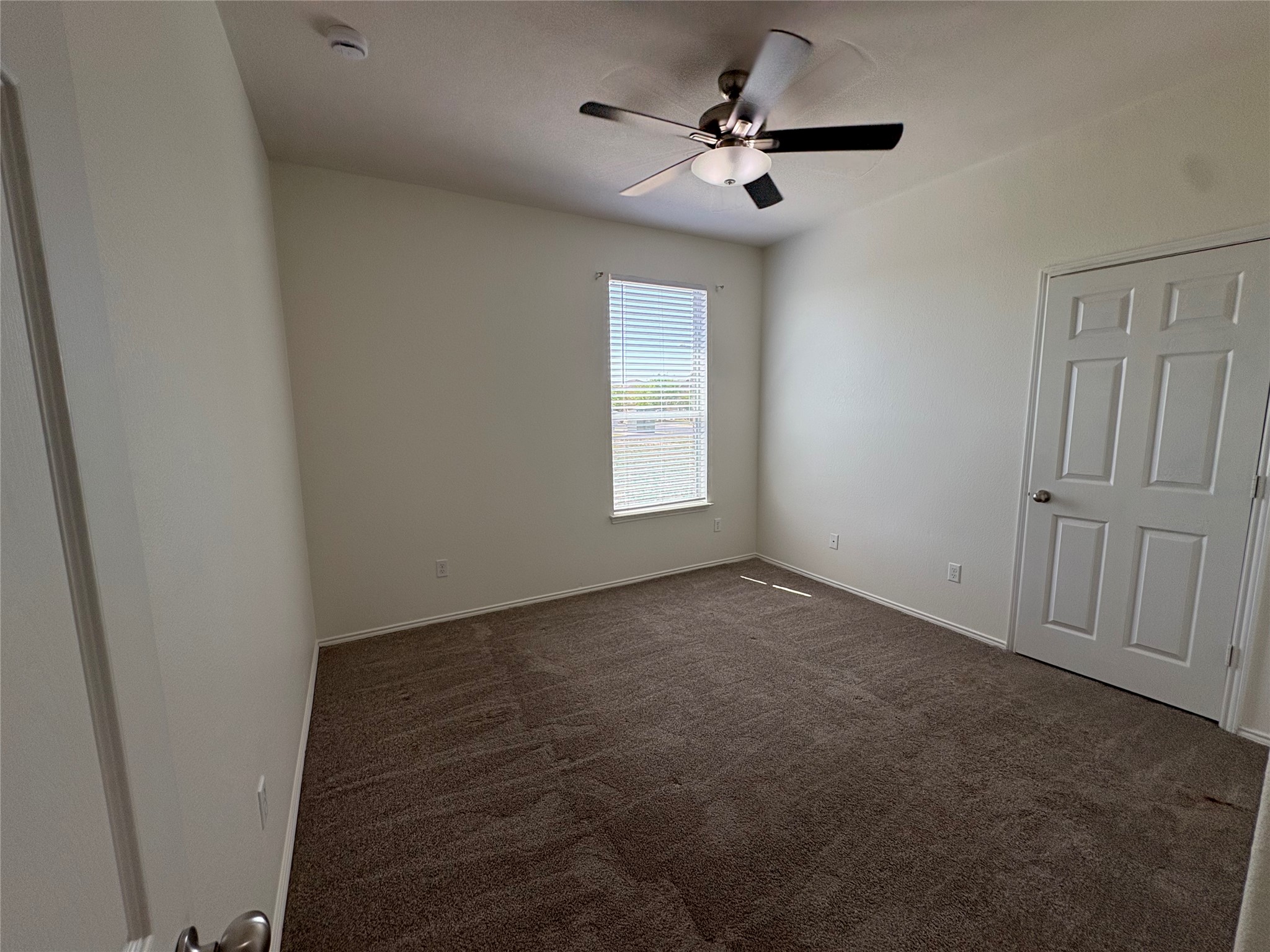 11617 Murron Drive Austin, TX 78754 - Photo 23 of 30 an empty room with windows and fan